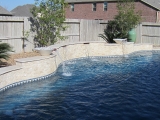 Ivory light travertine ledger stone veneer split face retaining wall San Ramon California