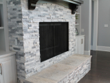 White marble around fireplace stone wall stacked ledger San Mateo